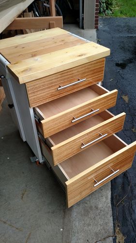 Wood cart with open drawers